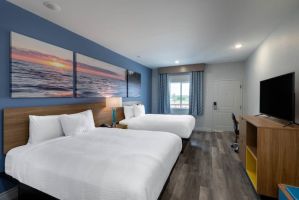 Guest room at the Days Inn & Suites by Wyndham Downtown/University of Houston in Houston, Texas